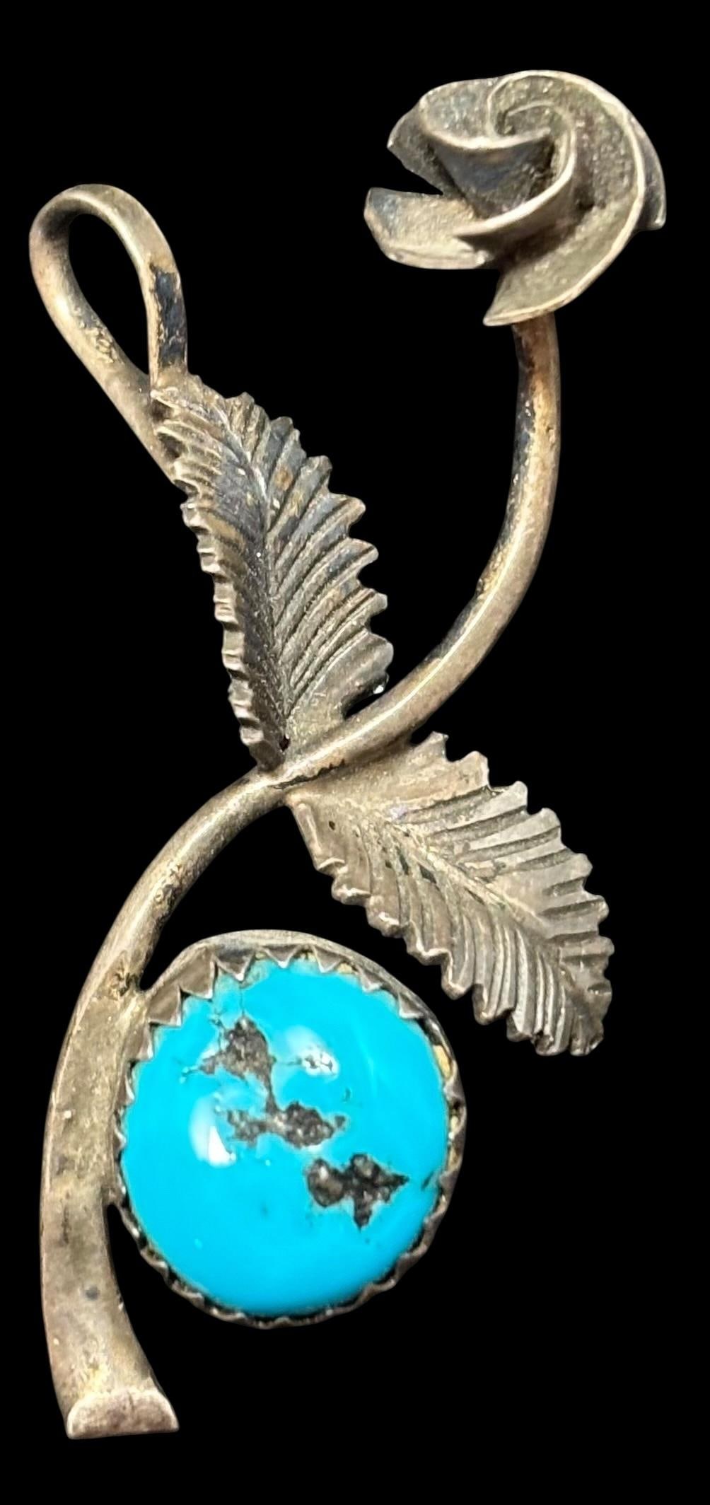 Antique Native American Navajo Sterling and Turquoise Rose Pendant: Native American Navajo sterling and turquoise rose shaped pendant. Sterling. Measures 1.5" x 1.25".