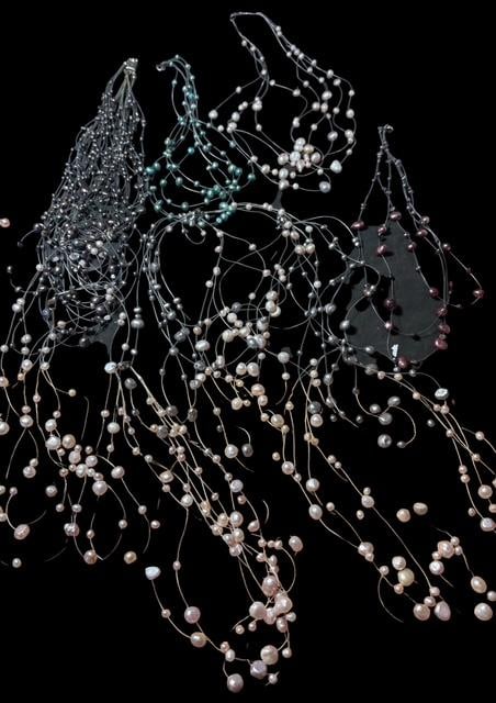 Lot of Ten Cultured Pearl Floating Necklaces: Lot of ten cultured pearl necklaces. Some multi strand, multi-color. Measure 17" long. Includes white and colored freshwater pearls.