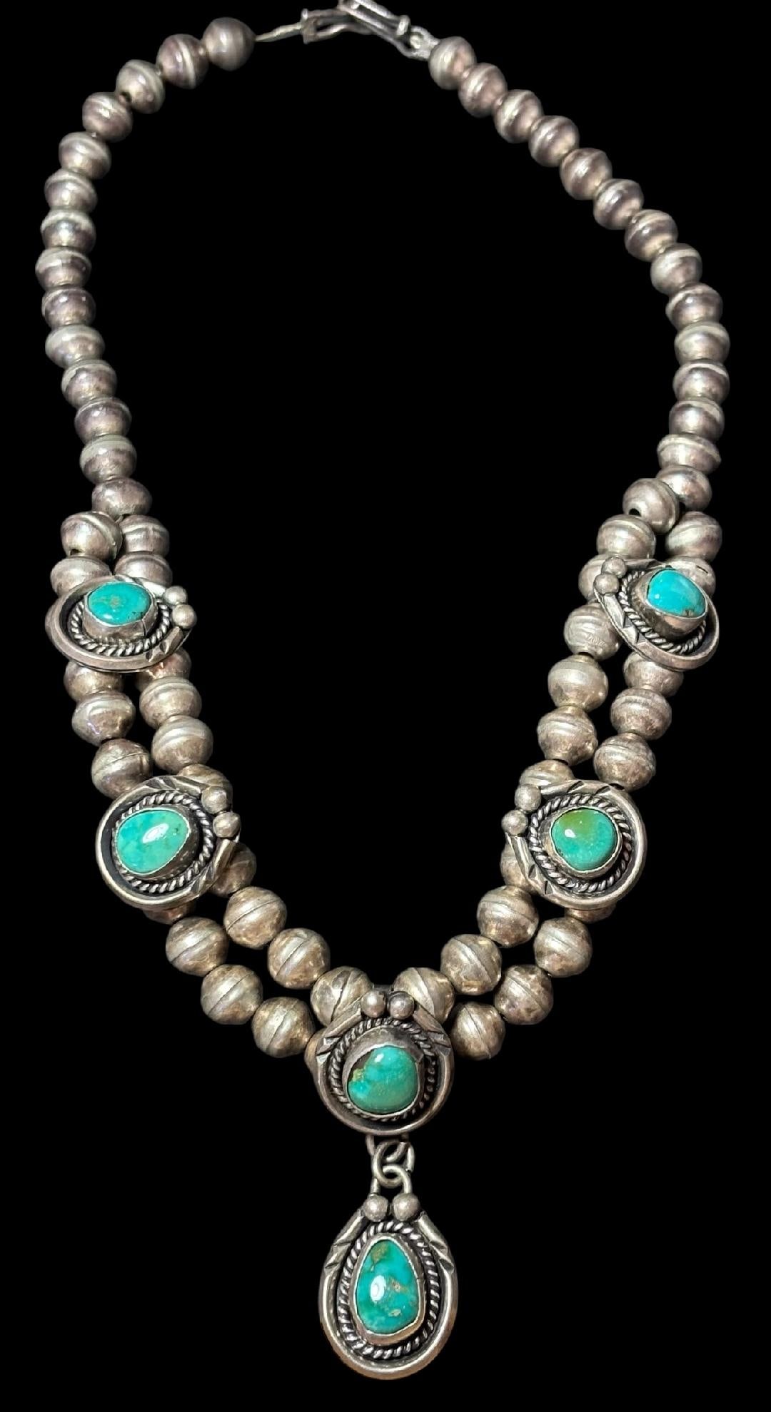 Native American Sterling and Turquoise Pendant Necklace: Native American sterling (tested) and turquoise pendant necklace. Necklace measures 17" with a .75" x 1.75" pendant.