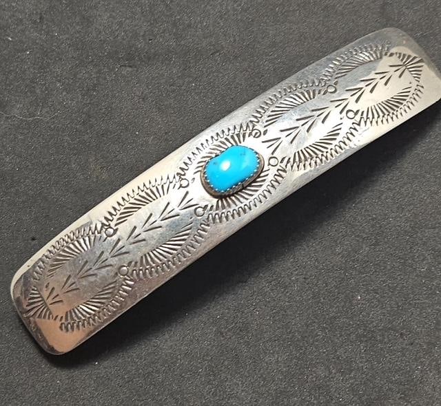 Native American Sterling and Turquoise Hair Clip: Native American sterling and turquoise hair clip. Nice hand stamp design with a lovely turquoise stone. Measures .75" x 3.75".