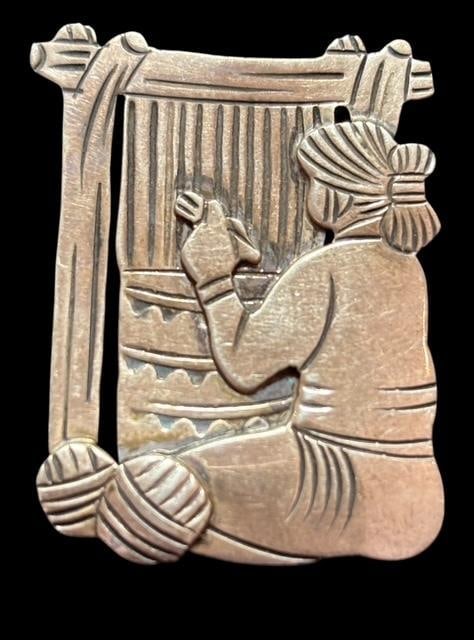 C. Perry Signed Native American Sterling Pin: Native American sterling pin of a Navajo woman weaving. Signed C. Perry. Measures 1" x 1.25".