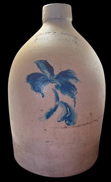 Frank B. Norton Stoneware Jug Worchester MA: Frank B. Norton stoneware jug with blue decoration. Frank Norton owned a pottery business from 1879 to 1885 in Worcester Massachusetts. Measures 12" tall.