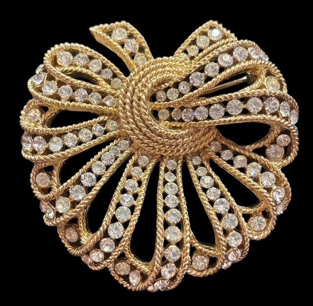 Signed Trifari Rhinestone Brooch: Rhinestone brooch signed Trifari. All stones intact. Measures 1.75" x 1.75".