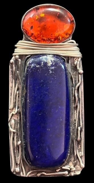 Lapis and Amber Signed Zoe Sterling Pendant: Lapis and amber pendant. Marked sterling and signed Zoe. Measures 1" x 2".