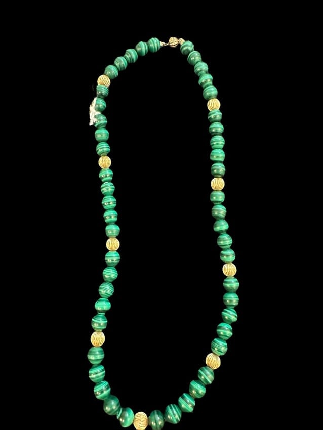 Malachite and Brass Beaded Necklace: Beaded Malachite and gold-tone brass necklace. Clasp is magnetic. Measures 18".