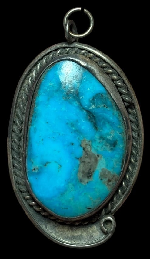 Native American Sterling and Turquoise Pendant: Native American sterling and turquoise pendant. Measures 1.5" x 1".