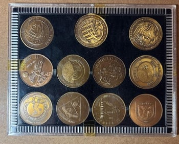 Set of Eleven Brass Apollo Tokens