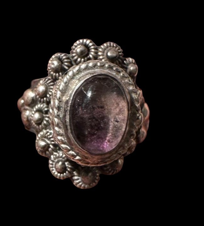 Taxco Mexico Stone Ring with Hinged "Poison Ring" Opening: Taxco Mexico adjustable ring with a top hinged opening. Like a "poison" ring. Stone is purple in color and appears to be amethyst. Size is adjustable.
