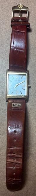Vintage Bulova Watch: Vintage Bulova watch #97M101. Original leather Bulova band with non-running face. Date and time on face. Case # C975516.