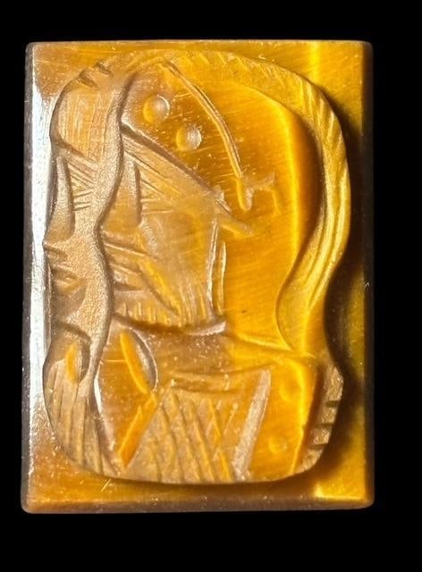Carved Tiger Eye Cameo for Jewelry Setting: Carved Tiger Eye cameo for jewelry setting. Measures .75" x .5".