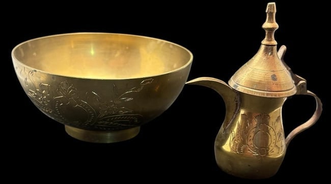 Middle Eastern Brass Decorative Tea/Coffee Pot and Bowl: Pair of Middle Eastern etched brass pieces. Includes a mini tea/coffee pot which is signed on base and measures 4" x 2.25". And a bowl, unsigned, that measures 5.5" x 2.5".