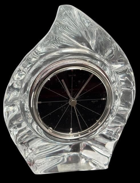 Signed Daum, France Art Glass Desk Clock: Art glass crystal desk clock with quartz movement. Signed Daum, France, and includes original label on base. Measures 6.75" x 5" x 3".