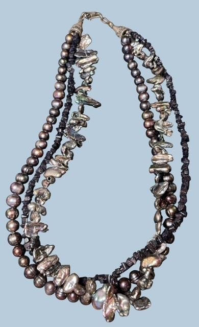 Multi-Strand Colorized Cultured Pearl Necklace: Three styles of freshwater and cultured pearls and black beads on triple strand 20" necklace.