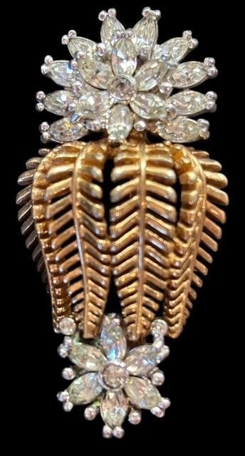 Mid Century Silvertone and Goldtone Brooch - Signed Pennino: Mid Century silver tone and gold tone with rhinestones brooch. Signed Pennino. Measures 2" x 1".