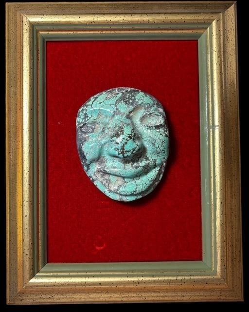 Antique Hand Carved Framed Chinese Turquoise Face: Antique hand carved turquoise Chinese face. Mounted on board and framed. Face measures 3.5" x 2.5". Framed art measures 9" x 7".