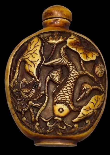 Chinese Yellow Resin Carved Snuff Bottle: Chinese yellow resin carved snuff bottle koi fish scene. Measures 2.5". Lidded, no spoon.