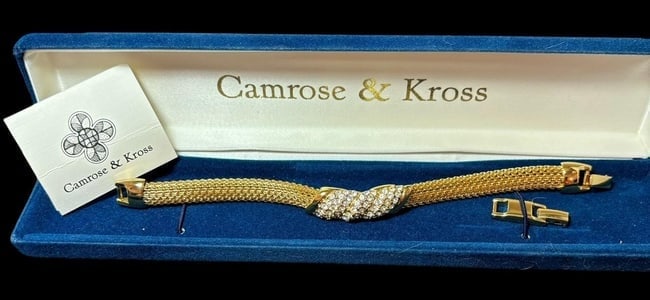 Jackie Kennedy Jewelry Collection Replica Bracelet: Jackie Kennedy Collection gold tone tailored mesh bracelet replica. Made of 24k gold plate and Swarovski crystals. Measures 7.5" long with a .75" extender. Includes paperwork and original box.