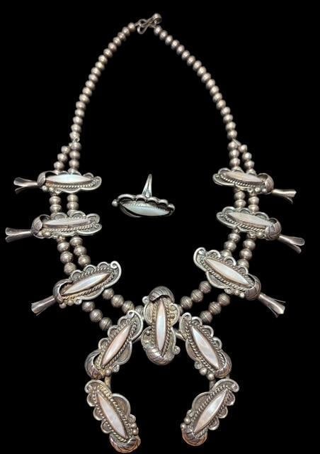 Navajo Squash Blossom with Mother of Pearl Inlay and Matching Ring: Native American Navajo sterling squash blossom necklace with oval mother of pearl inlay. Measures 17" with Naja measuring 2.5" x 2.625". Includes matching ring size 5.5.