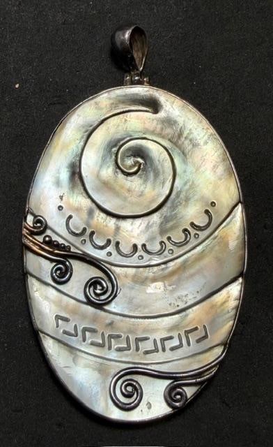 Signed Albalone and Sterling Pendant: Albalone and sterling pendant. Signed NF and marked .925. Measures 1.5" x 2.5". Lovely design.