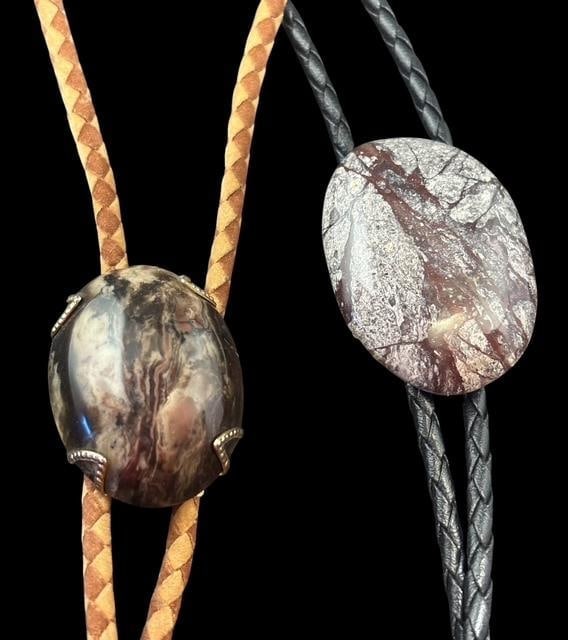 Pair of Agate Stone Bolo Ties: Two bolo ties one agate 1.25"x1.75" with 36" cord. Other brass tone tips with polished stone 1.5"x1.25" and 33" cord.