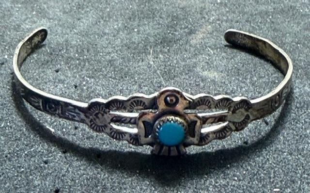 Native American Navajo Children's Sterling Cuff Bracelet: Native American Navajo children's sterling and turquoise cuff bracelet. Fred Harvey style. Measures 5" around with a 1.5" cuff opening. Weighs 4 g.