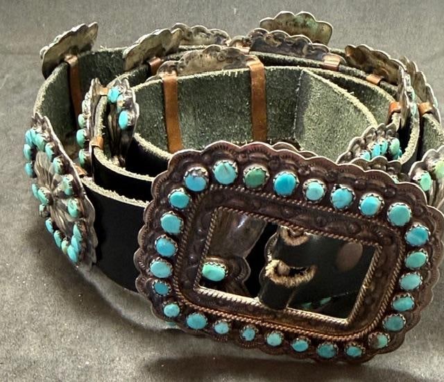 Native American Navajo Signed Sterling Concho Belt Victor Moses Begay: Native American Navajo sterling concho belt. Singed VMB, for well-known silversmith Victor Moses Begay. Belt measures 40" with 17 conchos and bow ties with turquoise stone accents. Buckle measures 2.5