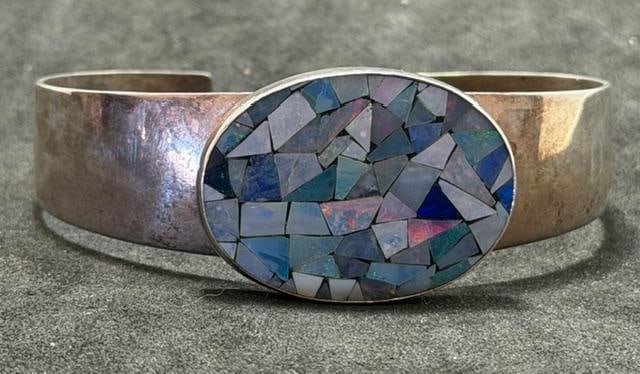 Chinese Sterling Cuff Bracelet Mosaic Abalone, Opal and Lapis Center Stone: Cuff bracelet marked China and 925 with mosaic stone center oval. Total weight 23g. Measures 6.25" around with a .75" cuff opening.