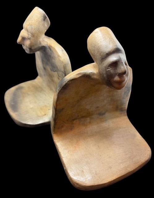 Pair of Stone Carved Biomorph Male Figural Bookends: Pair of stone carved bookends. Measure 5" x 4" x 6.5".