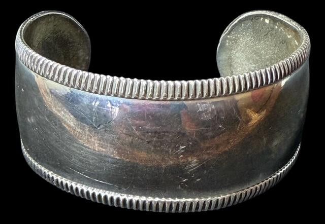 Taxco Mexico Sterling Cuff Bracelet: Taxco Mexico sterling cuff bracelet. Marked .925 and TE-51. Measures 7" around with a 1.25" cuff opening. 40.9 grams