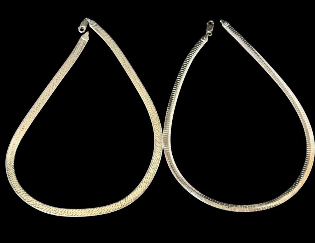 Italian Sterling Serpentine Necklaces: Pair of Italian sterling serpentine style necklaces. Marked .925. 1) Measures 17" and is 3/16" wide. Weighs 26g. 2) Measures 18", measures 1/4" and weighs 28g.