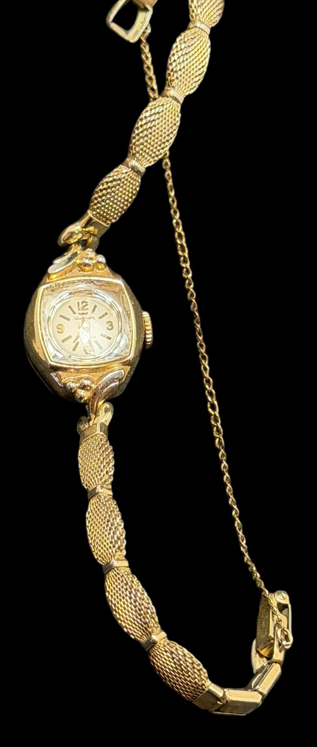 10K Gold Filled Band - Waltham Ladies' Watch: Waltham ladies watch with a 10K gold filled band. Base metal bezel with steel case. Approximate circumference when clasped is 5.5"