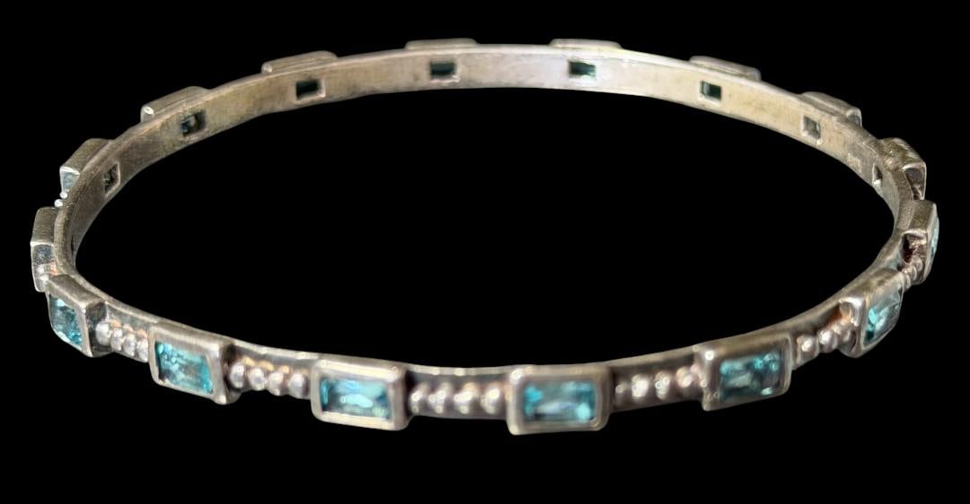 Aquamarine and Sterling Bangle Bracelet: Aquamarine and sterling bangle bracelet. Marked .925. Total weight 16g. Measures 7.5" around.