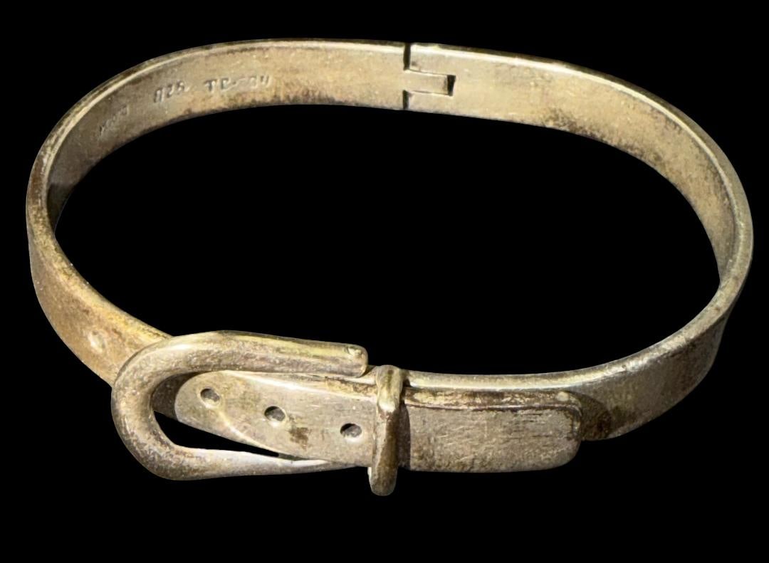 Taxco Mexico Sterling Bracelet: Taxco Mexico sterling adjustable bracelet. Interesting belt shape design. See photos. Weighs 35g.