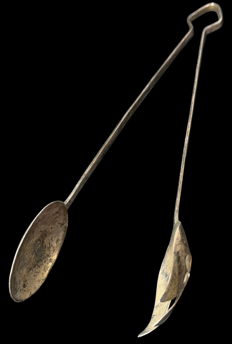 Sterling Serving Tongs: Sterling serving tongs. Total weight 74 g. Measure 10" long by 1.75" wide at the ends.