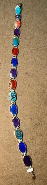 Sterling and Stone Bracelet Lapis, Spiny Oyster, Turquoise: Sterling and stone bracelet. Stones include lapis, turquoise, spiny oyster and more. See photos. Measures 7" unclasped. Marked .925. Total weight 12g.