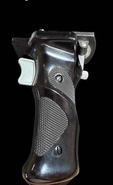 German Rollerflex Grip for TLR Cameras: German rollerflex pistol style grip for twin lens reflix TLR cameras. Grip measures 4" x 3" x 6". Cable measures 11".