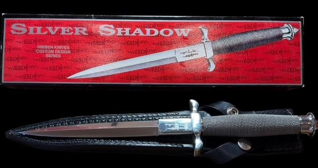 Silver Shadow Knife by Master Knife Maker Gil Hibben: Silver shadow knife #UC441. Custom designed by Gil Hibben of Hibben Knives. Includes leather sheath and original box. Measures 12.5" in total length. Blade measures 7.75".