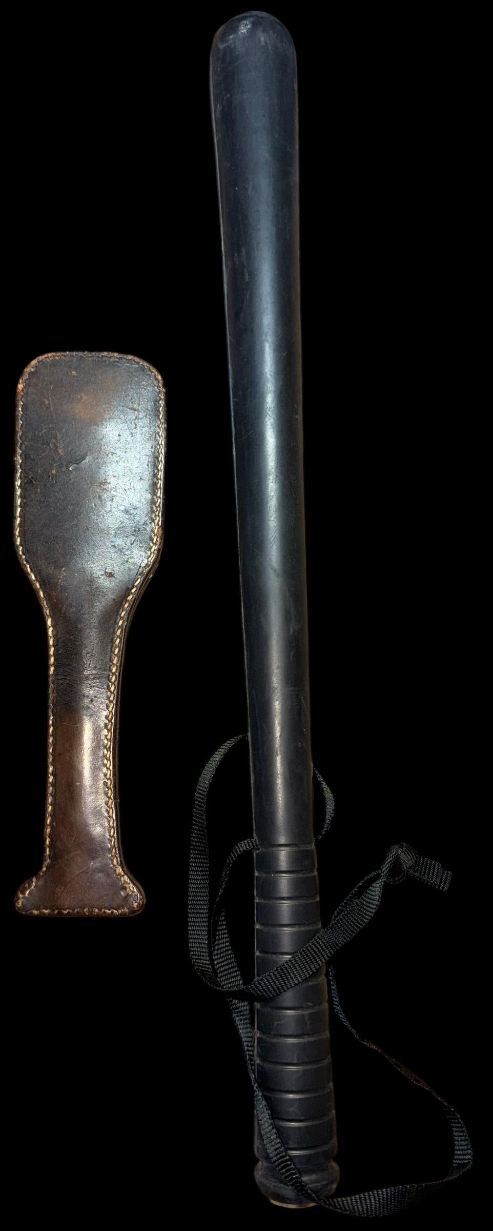 Military Police Rubber Night Stick and Leather Black Jack: Military police rubber night stick and leather blackjack. Night stick measures 19.75" long by 1.75" across. Signed "Combat. Blackjack is antique and measures 9.75" x 2.75" at widest point.
