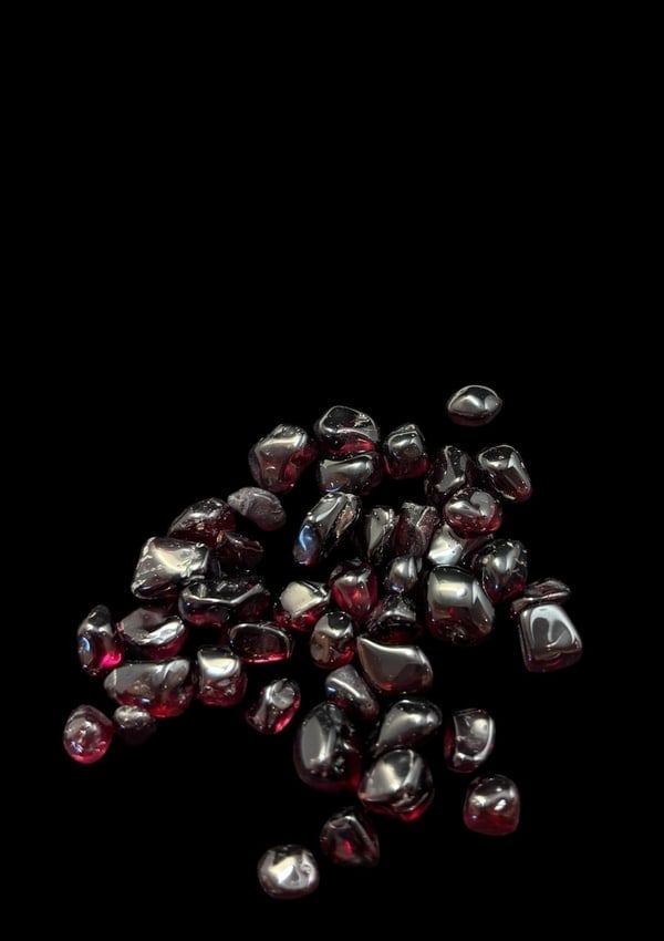 Lot Polished Garnet Stones: Lot of polished garnet stones. Quarter for size.