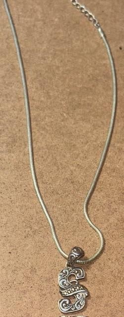 Sterling and 18K Gold Pendant Necklace: Sterling pendant with 18k overlay on a sterling 18" chain. Pendant measures .5" x 1.25".