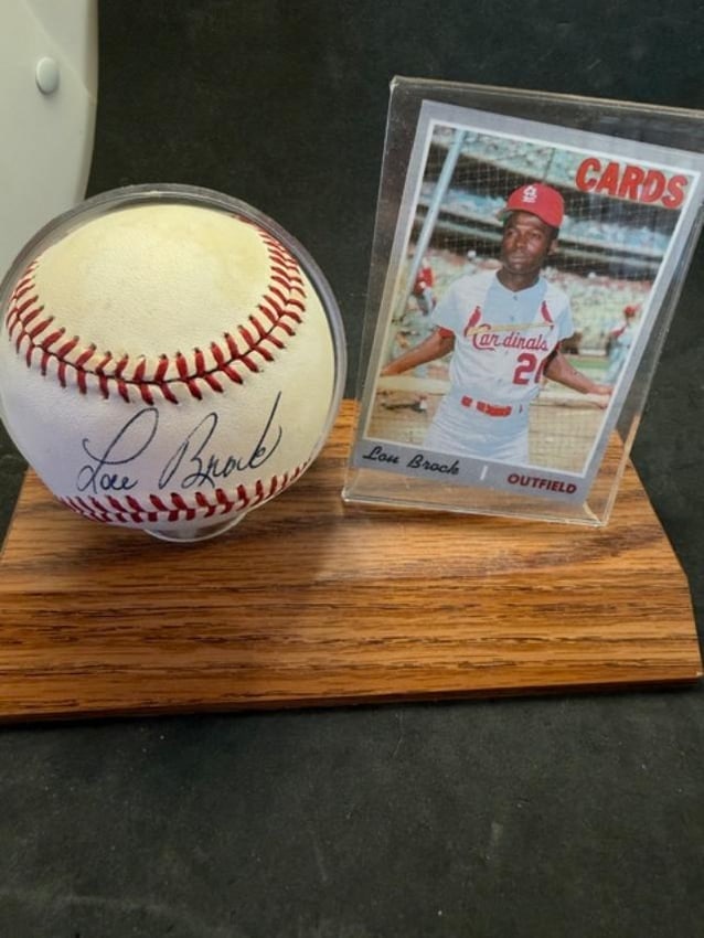 Lou Brock Autographed Baseball and Baseball Card: Lou Brock signed Rawlings baseball and Topps baseball card. No COA and card is unsigned and ungraded. Stargell played for the Arizona Cardinals and was a Hall of Fame Player. Measures 7" x 3.75" x 5.5