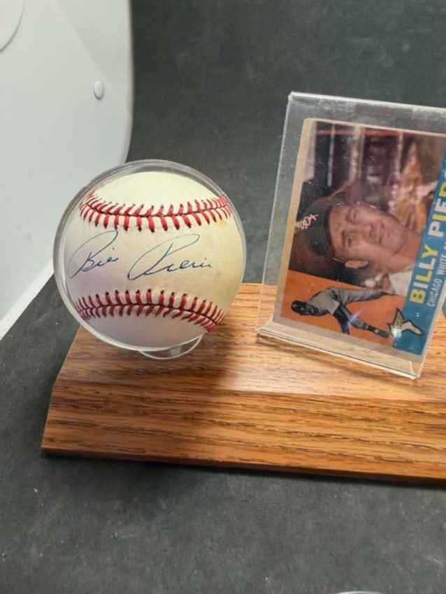 Billy Pierce Autographed Baseball and Baseball Card: Billy Pierce autographed baseball and Topps #150 baseball card. No COA and card unsigned and ungraded. Pierce played for the Chicago White Sox. Measures 7" x 3.75" x 5.5".