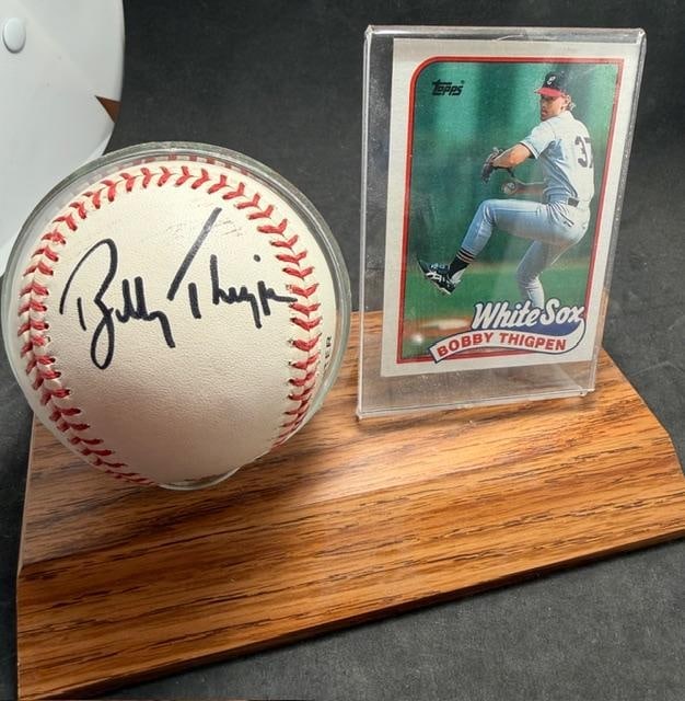 Bobby Thigpen Autographed Baseball and Baseball Card: Bobby Thigpen autographed Rawlings baseball and Topps baseball card #762. No COA and card unsigned and ungraded. Thigpen played for the Chicago White Sox. Measures 7" x 3.75" x 5.5".