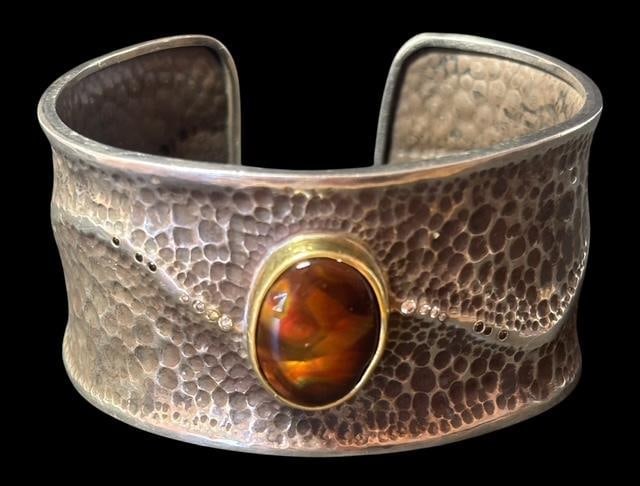 18K Gold, Diamonds, Sterling, Arizona Fire Agate Cuff Bracelet by Dianne Funk: Sterling silver cuff bracelet with natural Arizona Fire Agate center stone. Bezel is 18K gold with side diamonds-white and black. Bought from Dianne Funk Productions. Original sales slip with bracelet