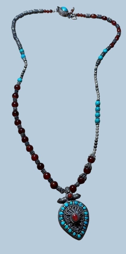 Tribal Middle Eastern Sterling Pendant and Turquoise Necklace: Middle Eastern tribal sterling pendant and turquoise beaded necklace. Bead stones are agate, silver, turquoise. 26" long, 2" pendant. Clasp is sterling with turquoise.