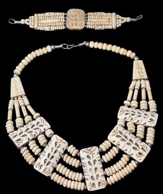 Antique Hand Carved Bone Necklace and Bracelet Set: Antique hand carved bone necklace and bracelet set. Nice intricate carving and design with sterling spacer beads. Necklace measures 18". Bracelet measures 7" open.