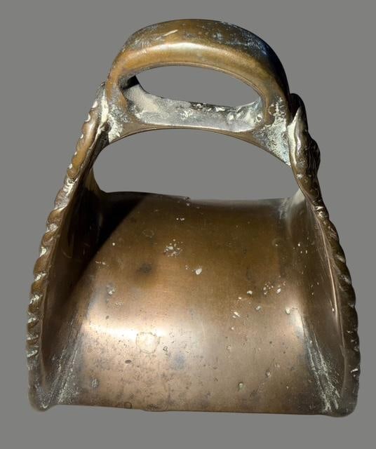 Antique Single Conquistador Stirrup: Single antique Conquistador stirrup. Appears to be signed and dated 1837 on base. Leather eye at top for strap. Design and braided edge. Measures 5" x 4.5" x 5.5".