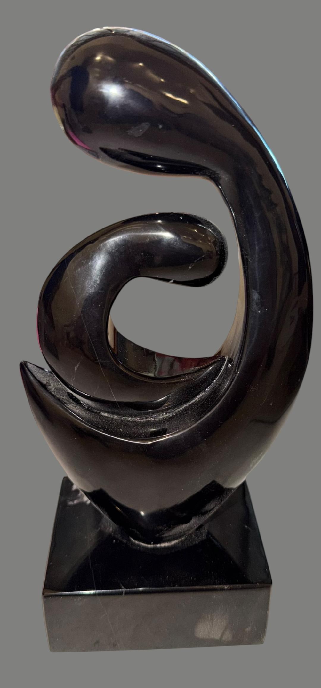 Stylized Mother and Child Onyx Sculpture: Stylized Mother and Child sculpture in polished black onyx. Modernist and abstract figures. In style of Leonardo Nierman. Measures 10" high by 3" x 4".