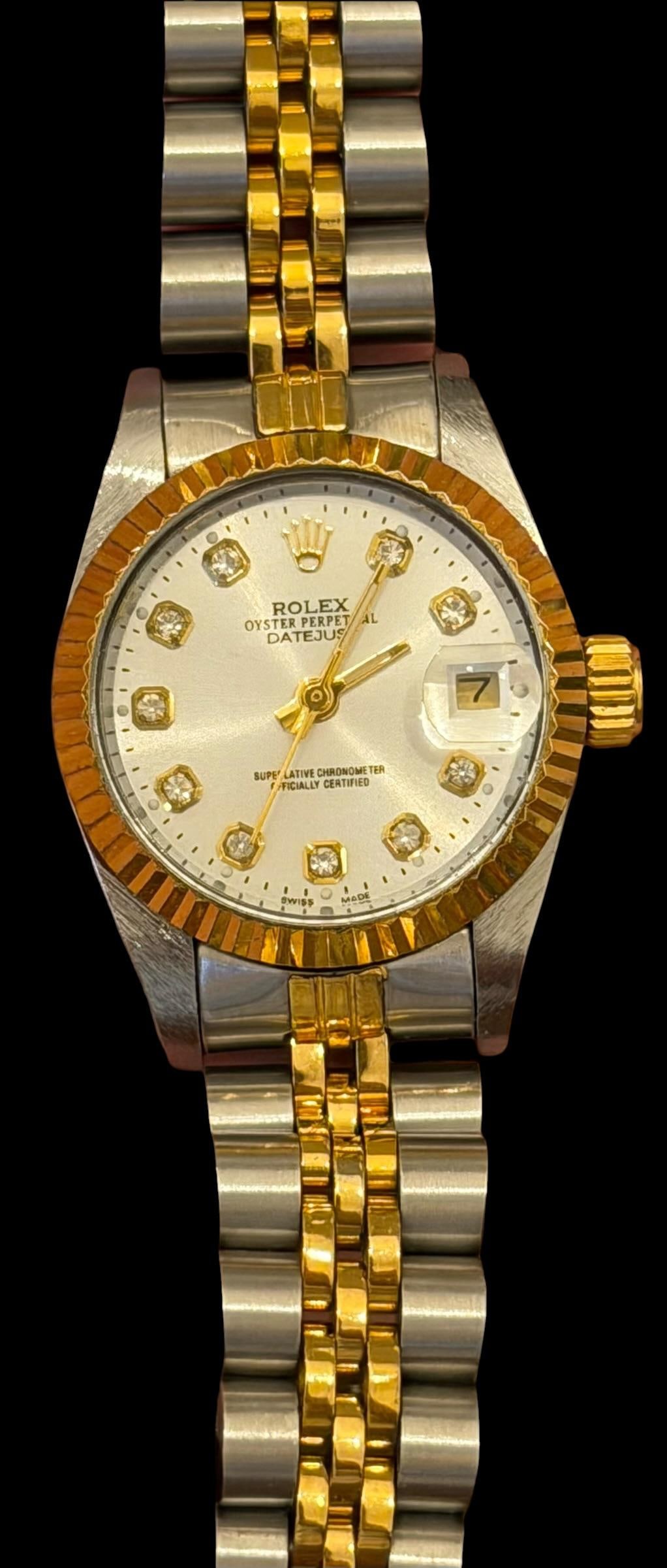 Ladies Rolex Watch Oyster Perpetual Date Just: Ladies Rolex watch. Oyster perpetual, date just watch. Has Rolex emblem and marked #16233 on back. Face approximately 1" across.