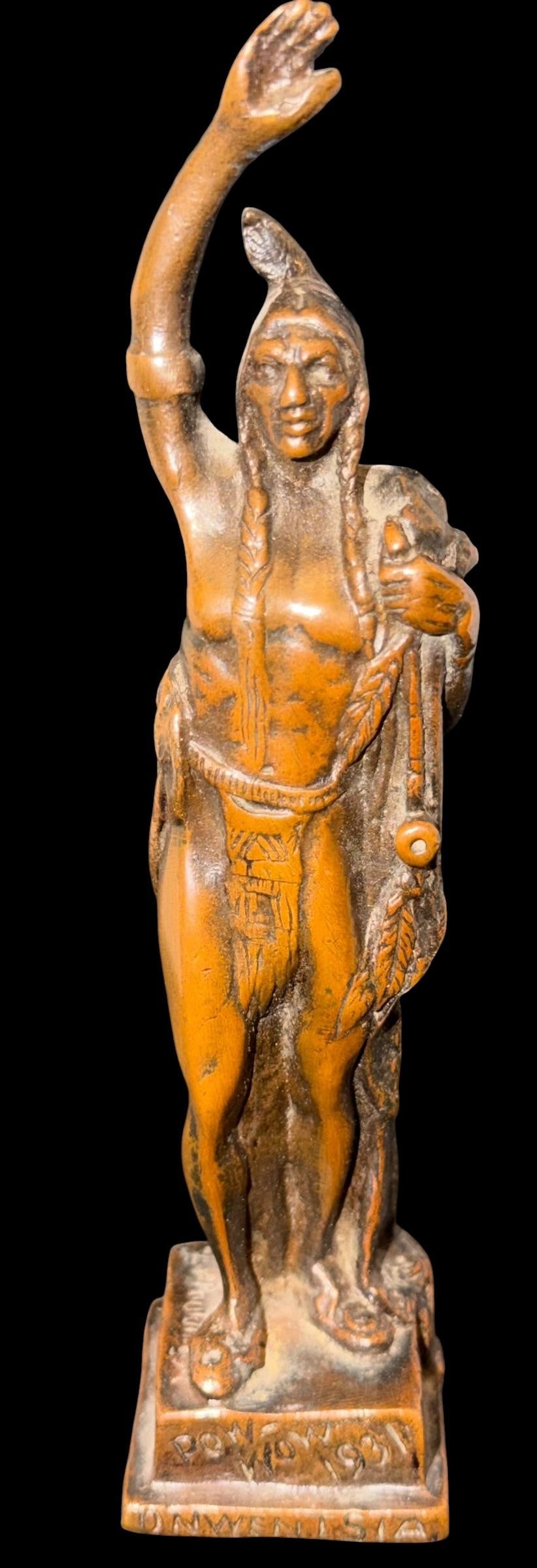 Bronze Pow-Wow Figurine Powwow 1931: Bronze figurine. Marked Powwow 1931, Harvest time festival in lake Forest Illinois. Sponsored by the Onwentsia Club. Measures 7" tall on a 1.5" x 1.75" base.